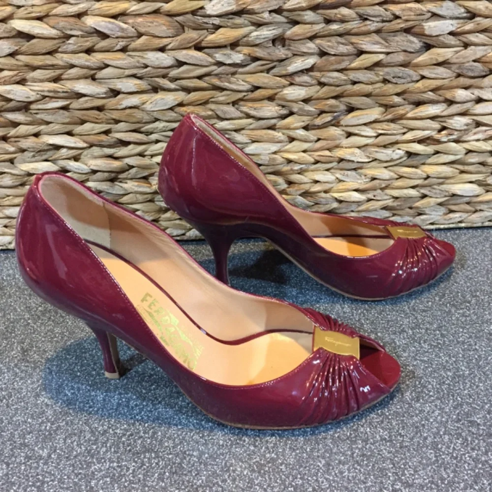 Salvatore Ferragamo Burgundy Patent Peep-Toe Heels with Gold Accent